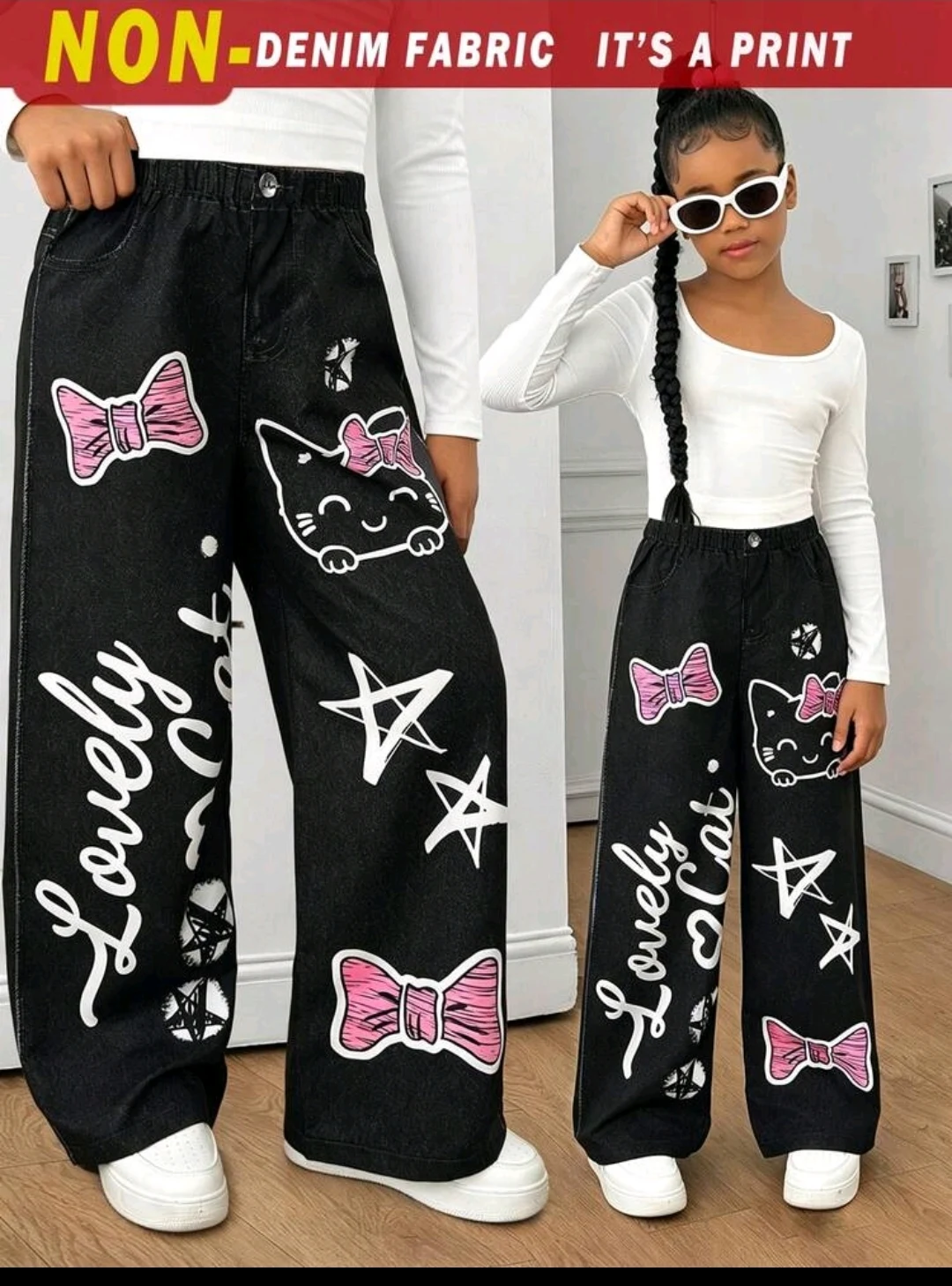 Pantalón negro gráfico de pierna ancha para niña
